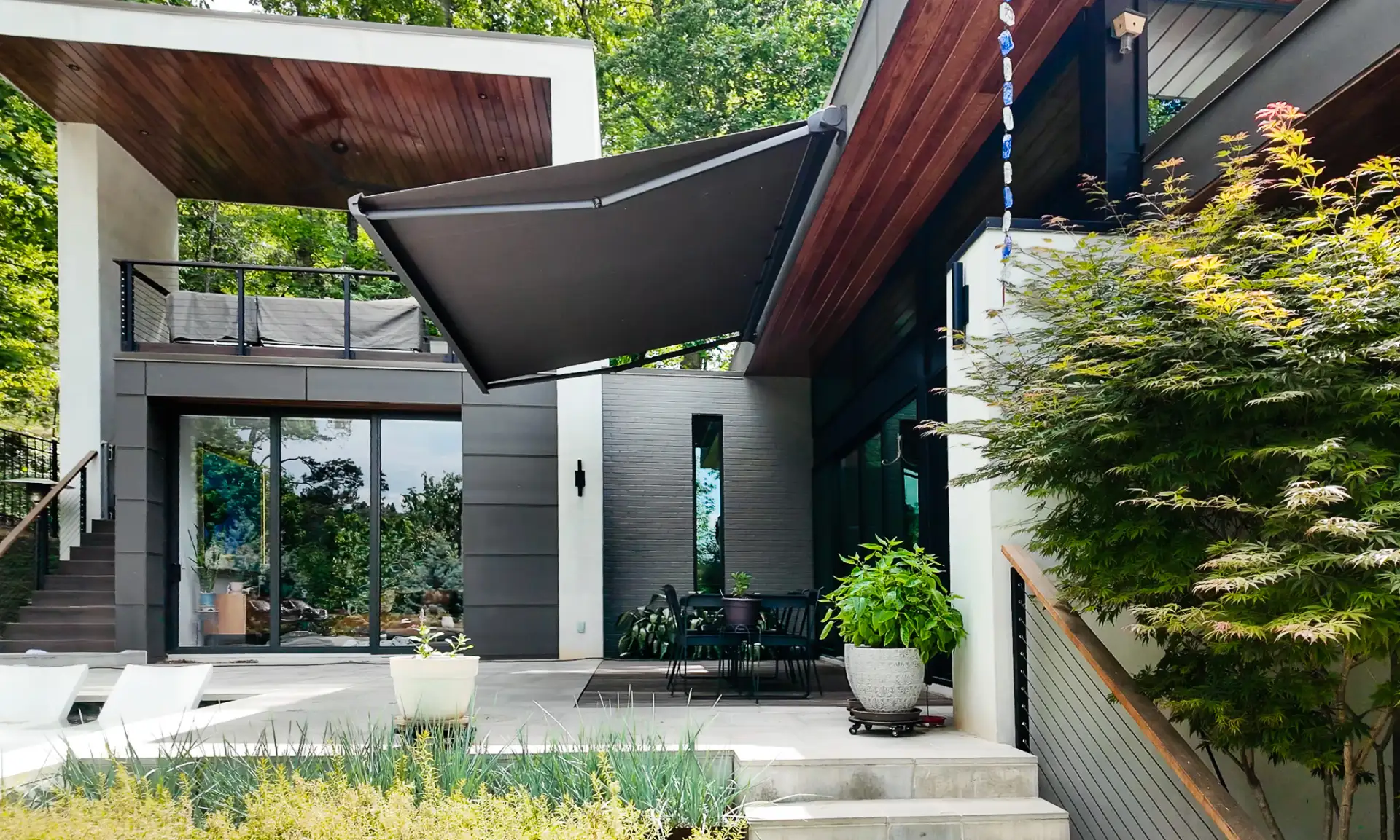 Premium KE retractable awning providing shade over a residential outdoor living area