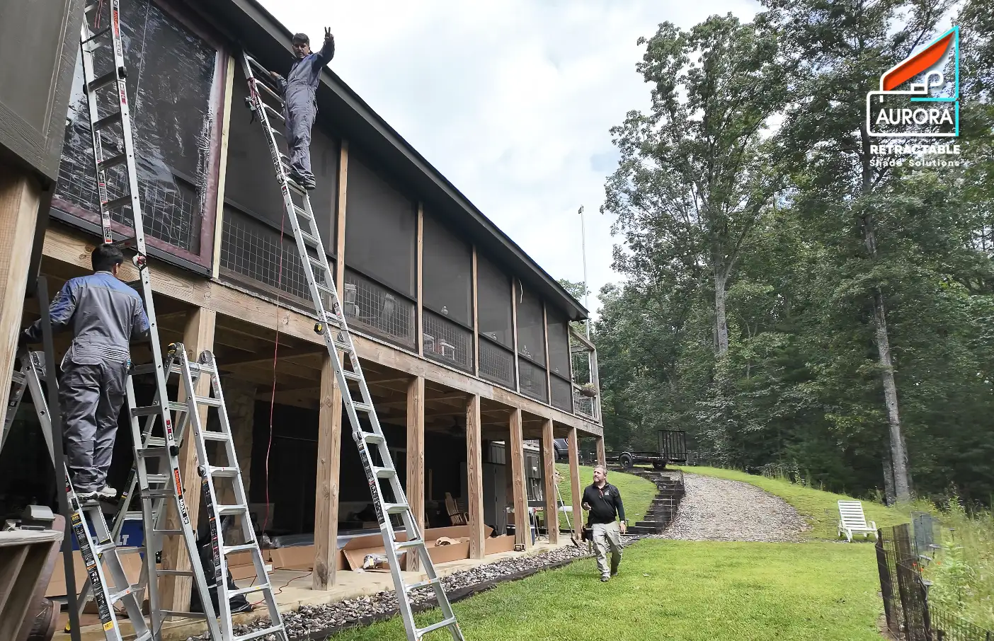 Aurora team professionally installing custom-made Retractable Screens at a residential deck project in Blairsville, Georgia