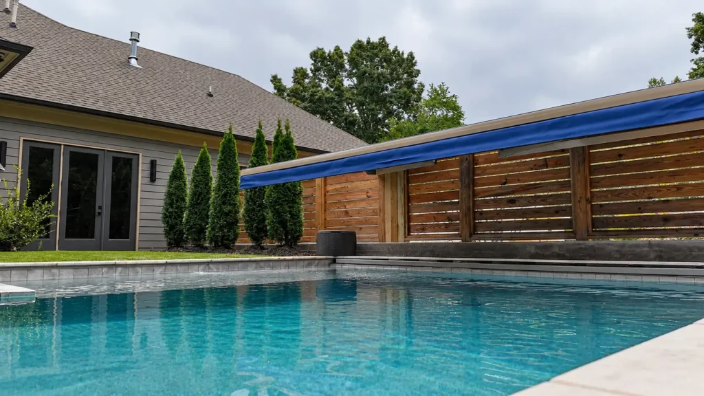 Retractable awning shading part of the pool water